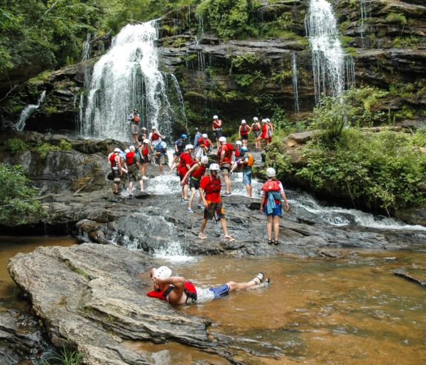 Guests relaxing by a Longcreek Falls on the Chattooga River Rafting: Section IV (with Lunch) trip