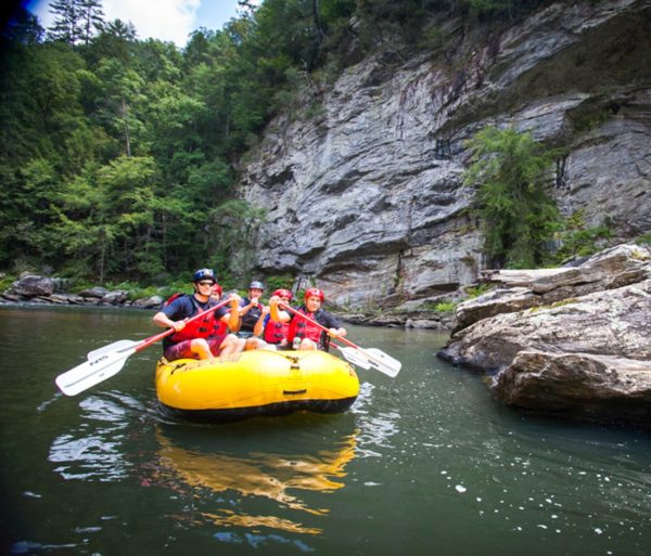 Chattooga River Rafting Class 4 Rapids down a yellow Nantahala Outdoor Center Raft.