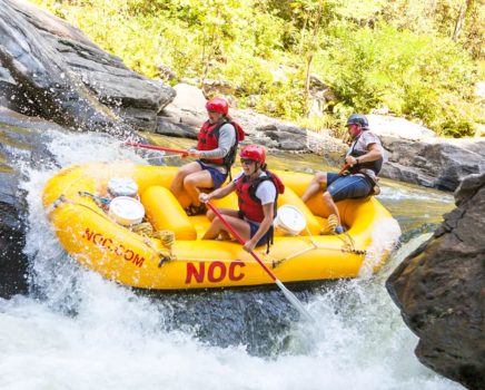 Chattooga River Rafting Class 4 Rapids down a yellow Nantahala Outdoor Center Raft.
