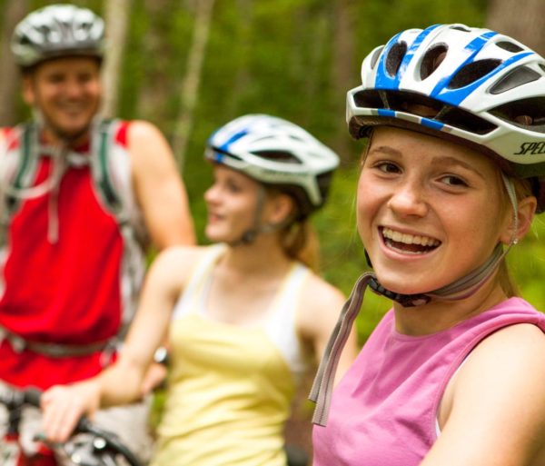 Three mountain biking guests smiling
