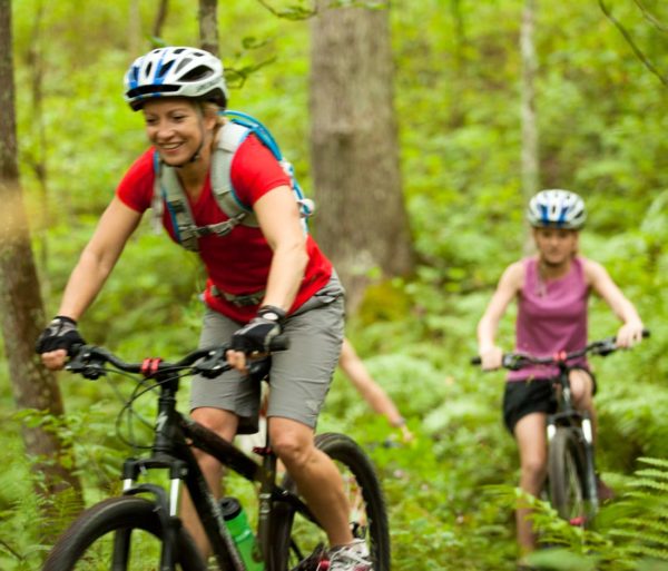 Two guests mountain biking